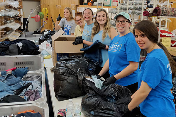 volunteers sorting through donations